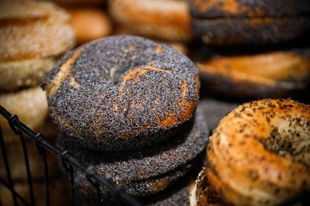 Sesame, poppyseed and everything bagels sit stacked in a basket at Pearl’s in Lexington.