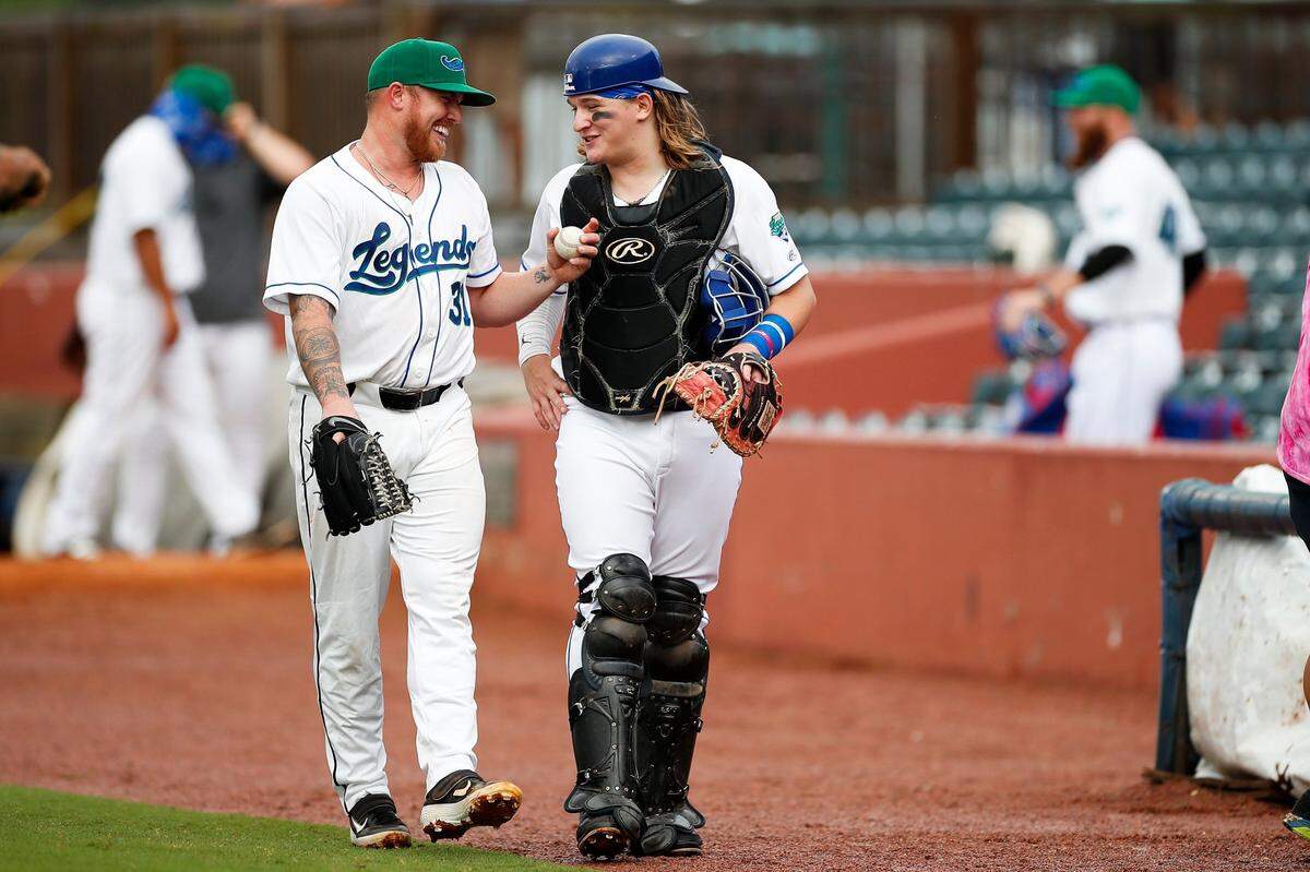 Lexington Legends pitcher Robbie Ross (31) joked with catcher Jakob Shuler before Saturday’s game against the Florence Y’alls at Whitaker Bank Ballpark.