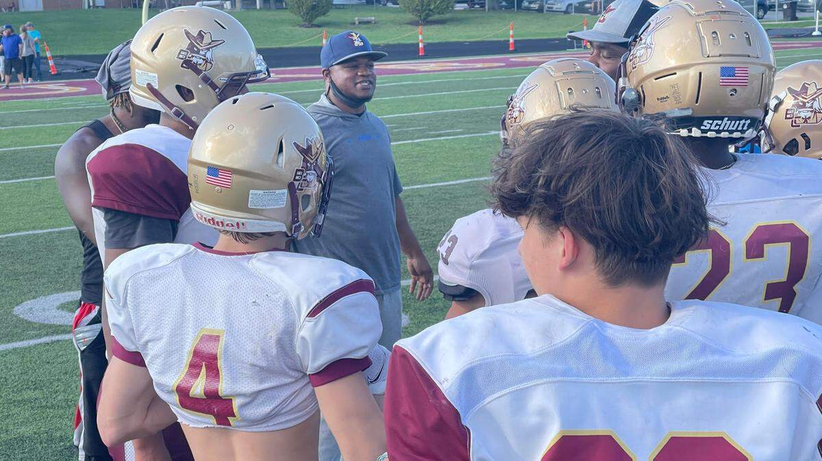 Bourbon County Coach David Jones, center, spoke with some of his players during their practice Wednesday at Bourbon County High School. The Colonels host Harrison County on Friday.