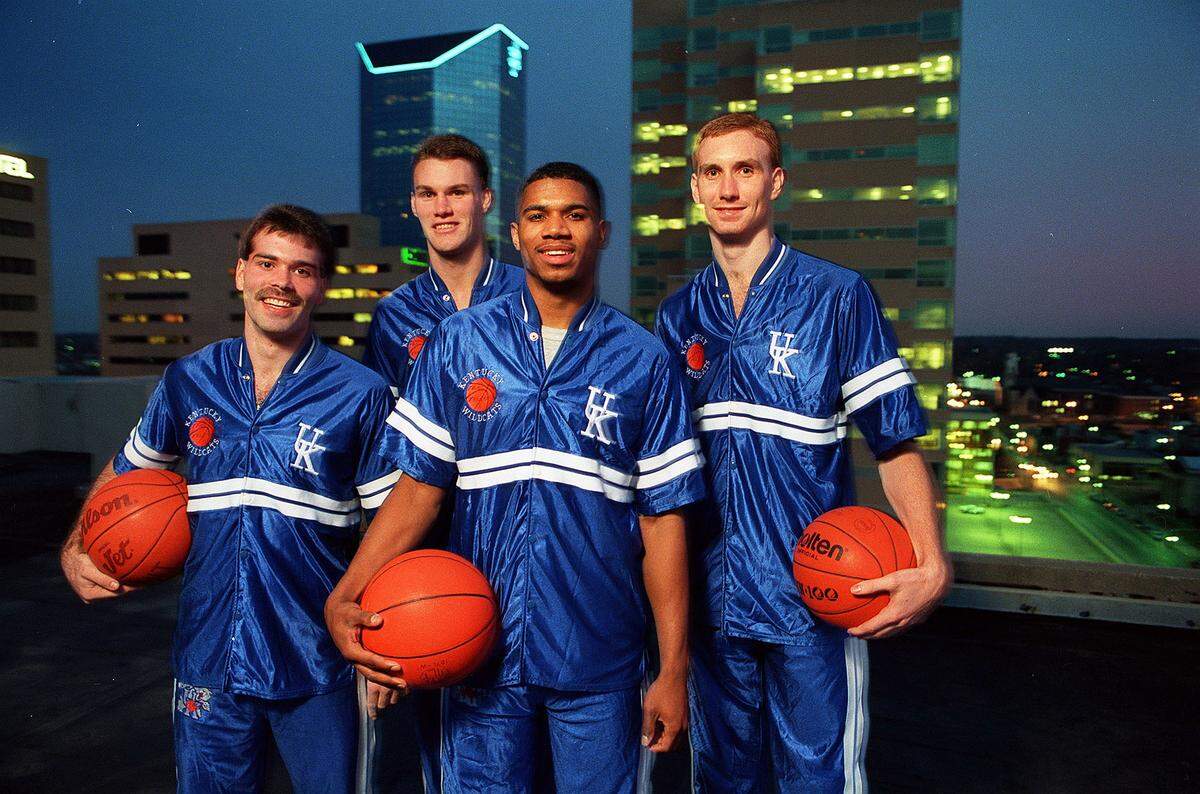 Kentucky’s 1992 senior class, also known as “The Unforgettables,” as pictured here in March 1992, in downtown Lexington. From left: Richie Farmer, Deron Feldhaus, Sean Woods and John Pelphrey.
