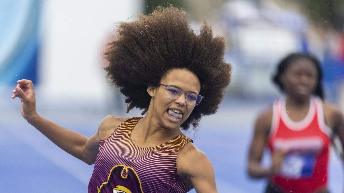 McCreary Central's Jolana Schenkel lets out a smile after winning the girls 100 meter dash during the 2026 KHSAA Boys and Girls Class 2A State Track and Field Championships at the University of Kentucky track and field complex in Lexington, Ky., on Friday, May 22, 2026.
