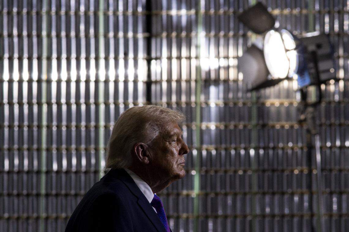 President Donald Trump watches Ed Gallrein speak to the crowd during his visit to Verst Logistics in Hebron, Kentucky, on Wednesday, March 11, 2026.