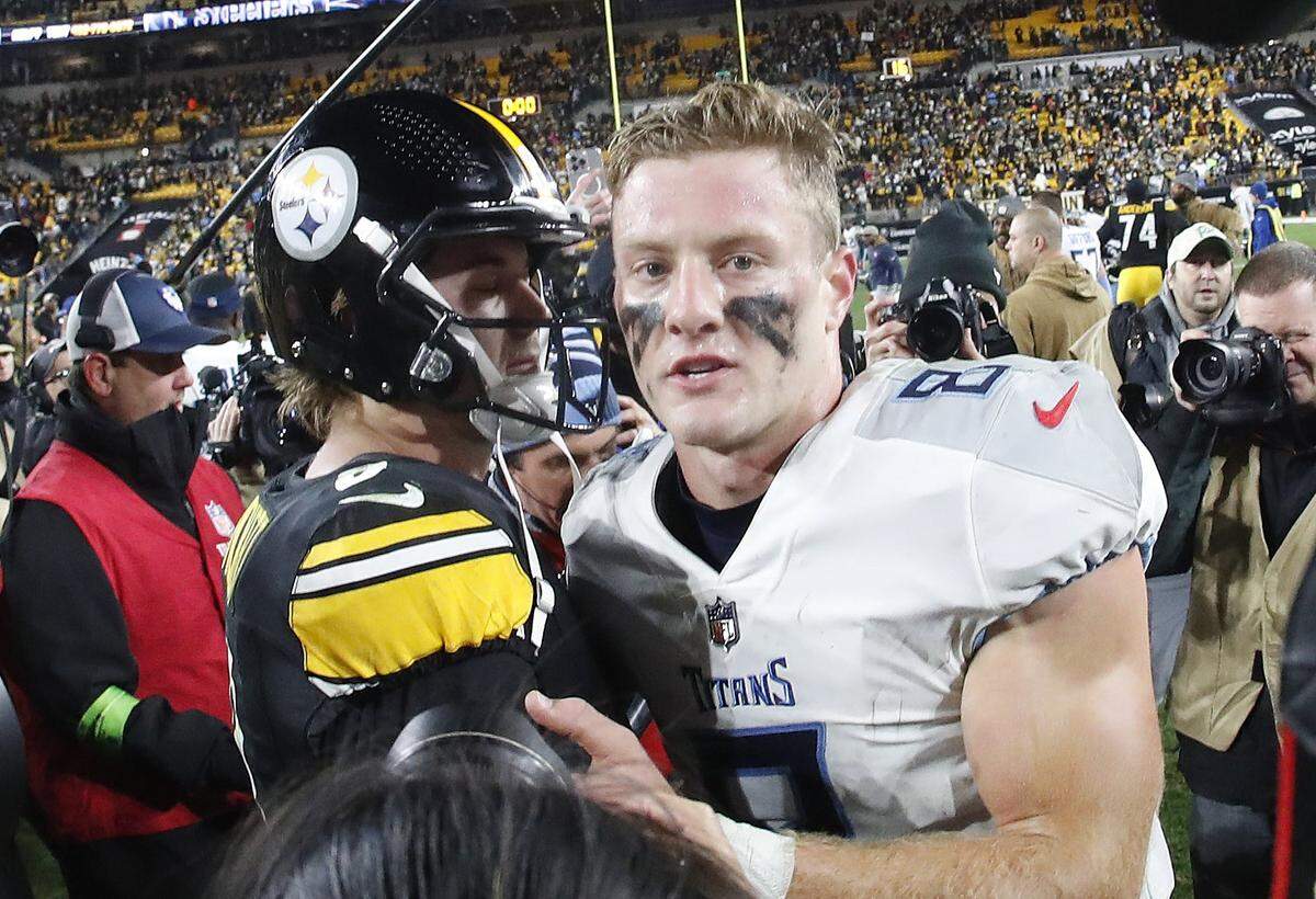 Steelers quarterback Kenny Pickett, left, and Titans quarterback Will Levis meet at midfield after Thursday night’s game in Pittsburgh. Tennessee lost 20-16.