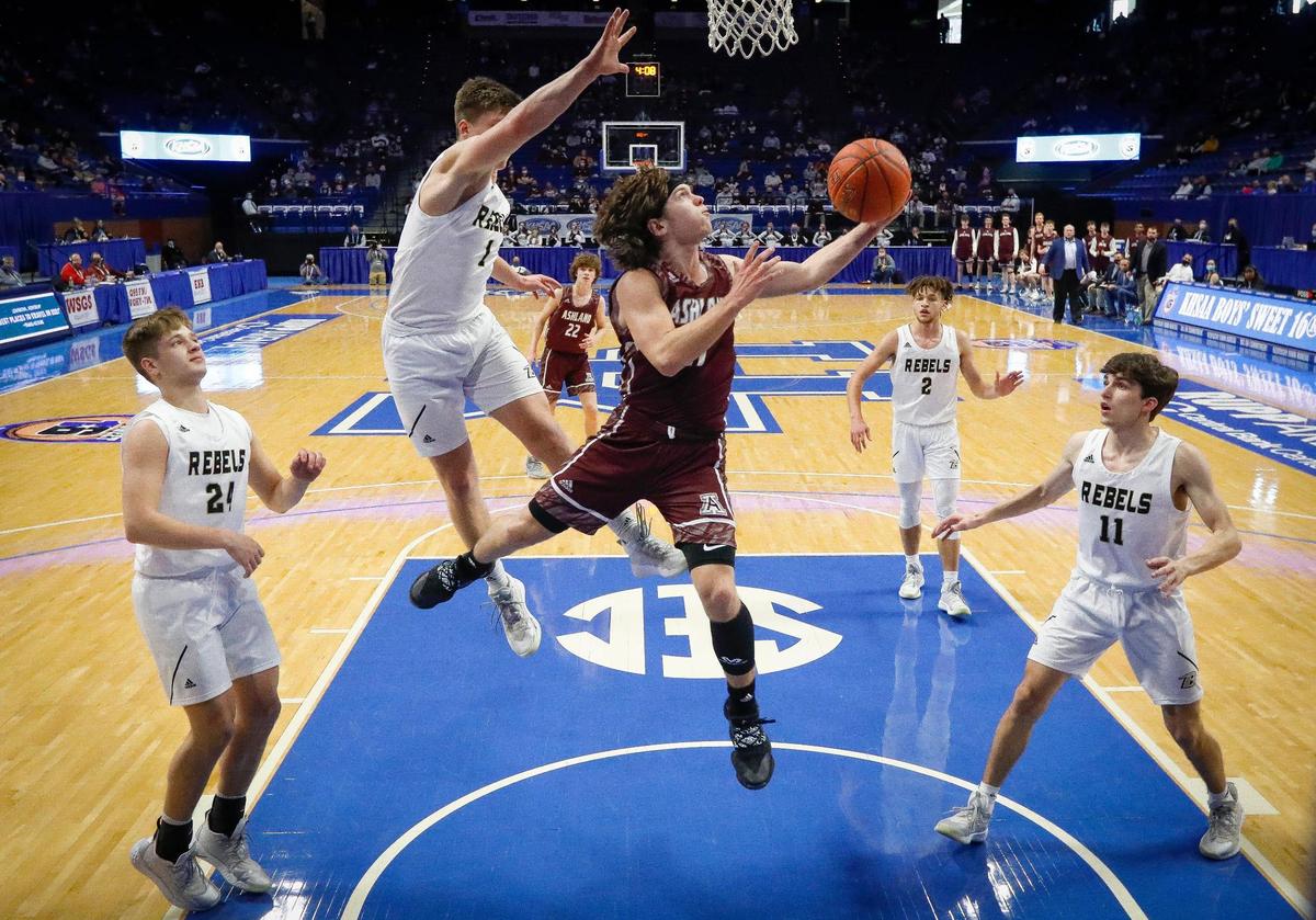 Ashland Blazer’s Colin Porter (11) scores among Boyle County’s Cruise Wilson (24), Luke Sheperson (1), Luke Imfeld (2) and William Carr (11) during Friday’s quarterfinals. Porter finished with 11 points, five rebounds, six assists and four steals in 22 minutes.