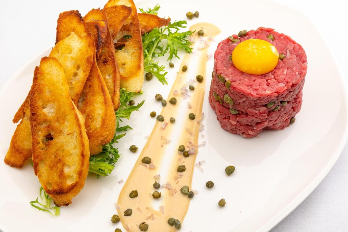 The Rassati Beef Tartare appetizer ($23) at Tony’s of Lexington is made with hand-cut beef tenderloin, topped with egg yolk and served with crostini bread.