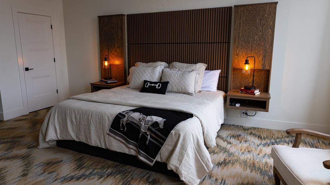 A plush queen-size bed complements a lavish suite at Hotel Thoroughbred, a 19-room boutique hotel undergoing restoration in downtown Paris, Ky, on Dec. 4, 2025.