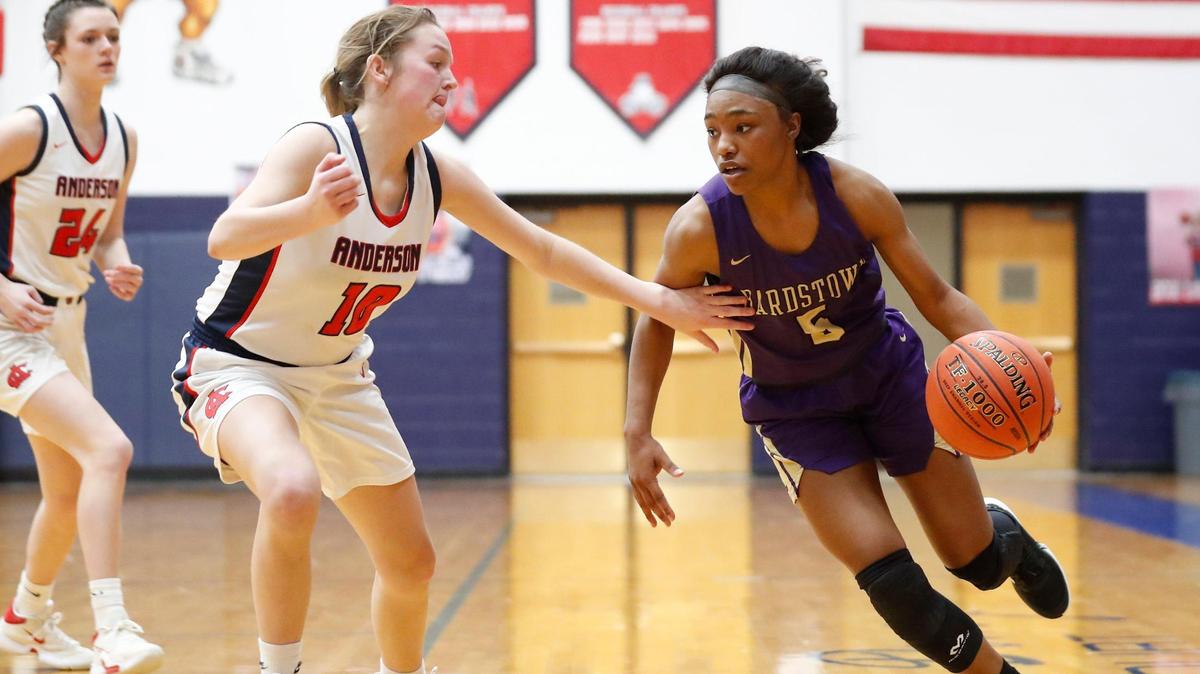 Bardstown’s Jaileyah Cotton (5) dribbles around Anderson County’s Rachel Satterly (10) during their game at Anderson County High School in Lawrenceburg, Ky., Friday, Feb. 19, 2021. Anderson County beat Bardstown 54-45.