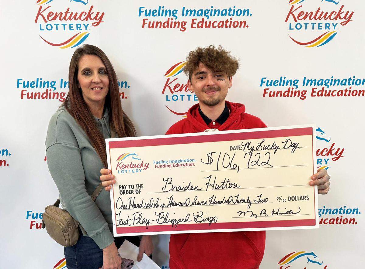 Braiden Hutton, of Corbin, poses with his winnings at Kentucky Lottery headquarters. 