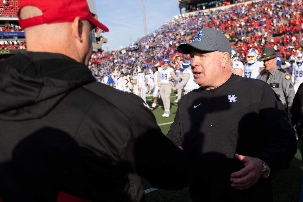 If U.S. District Judge Claudia Wilken approves the agreement to settle three different antitrust suits filed by ex-athletes vs. the NCAA, then Kentucky football coach Mark Stoops, right, and Louisville head man Jeff Brohm, left, will probably find themselves coaching teams with players being paid directly by their schools.
