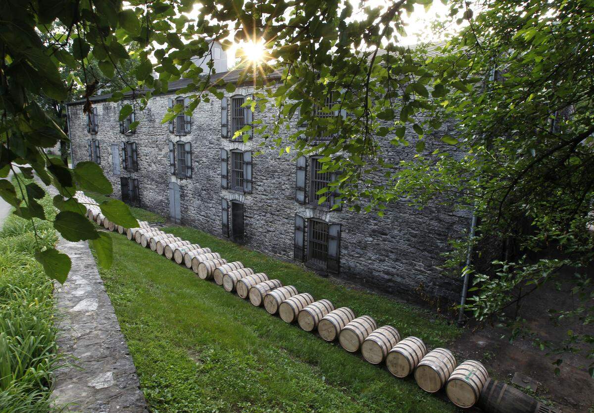 Freshly filled barrels of Woodford Reserve were rolled along the barrel rail to be placed in warehouses at the distillery near Versailles. The warehouse was built circa 1890-1892.