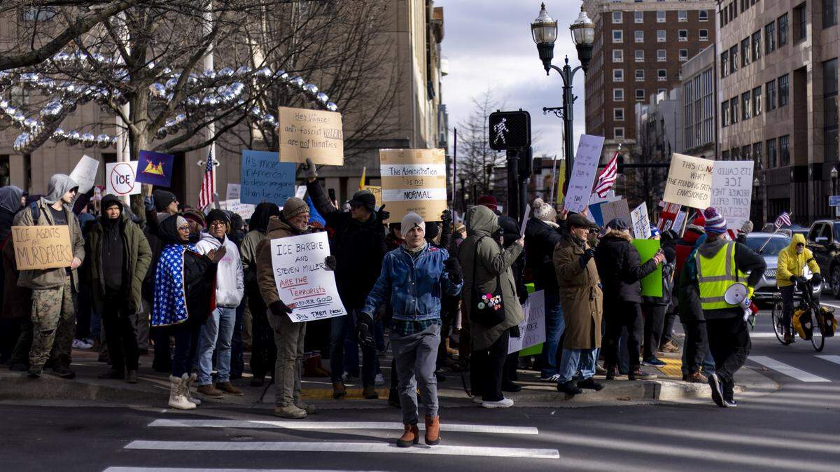 Eric Olson, center, a Lexington resident, crosses the street during an “ICE Out For Good” rally Jan. 11, 2026, at Courthouse Plaza in Lexington. It’s one of more than a thousand protests across the country  following the Jan. 7, 2026, shooting of Renee Good, 37, of Minneapolis, by a Immigration and Customs Enforcement agent.