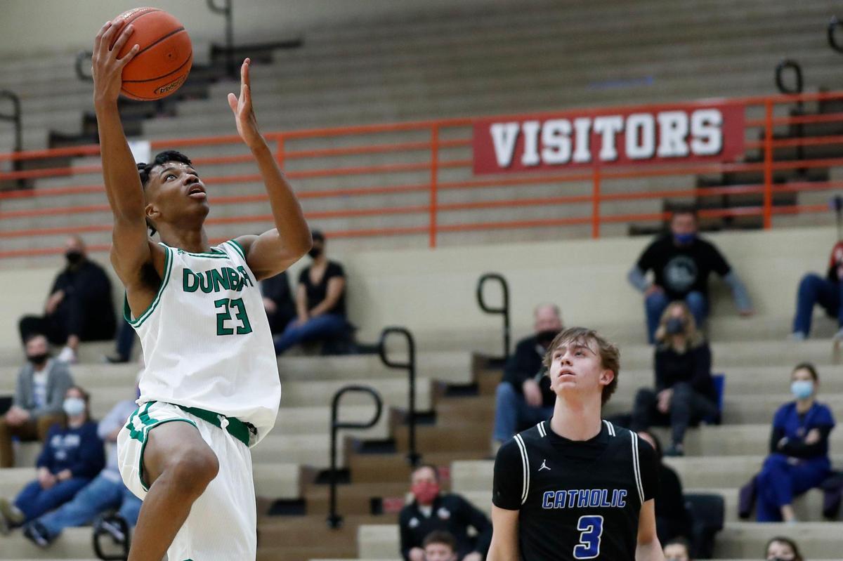 Paul Laurence Dunbar’s Tim Hall (23) is averaging nearly a double-double this season. He had 19 rebounds on Friday night against Lexington Catholic.