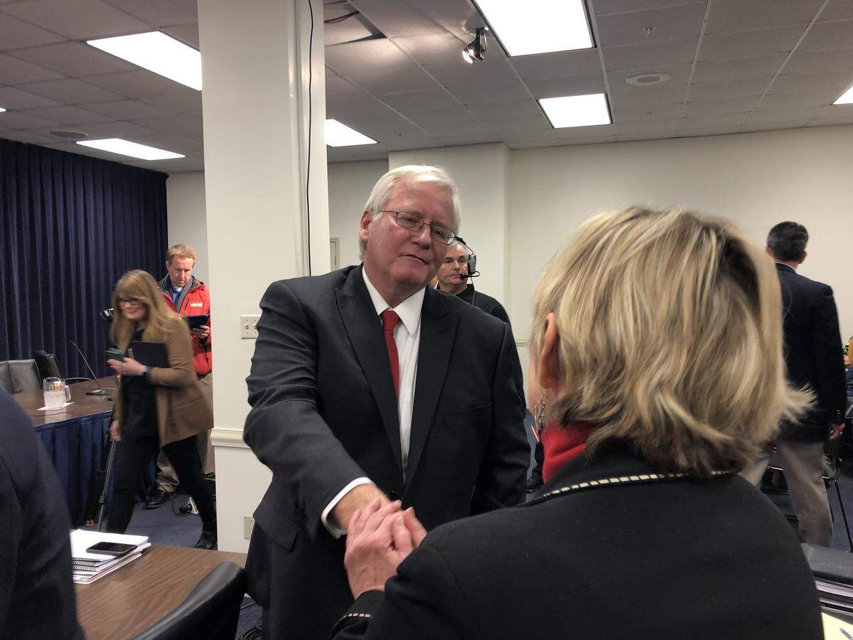 Former Rep. D.J. Johnson, R-Owesboro, shakes Rep. Mary Lou Marzian’s, D-Louisville, hand after he withdrew his contest to an election he lost by only one vote.