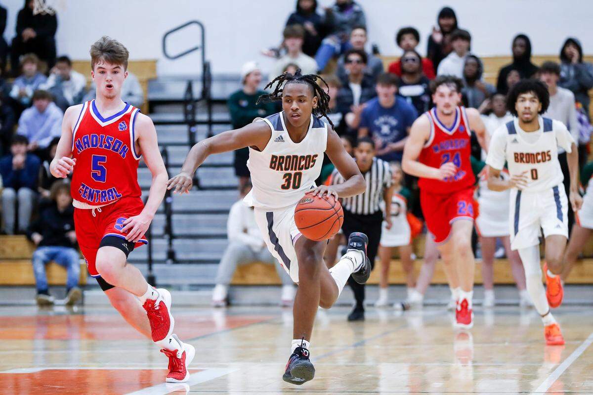 Frederick Douglass’ Noah Jones (30) dribbles against Madison Central’s Landon Ray (5) during a game in Lexington on Jan. 20.