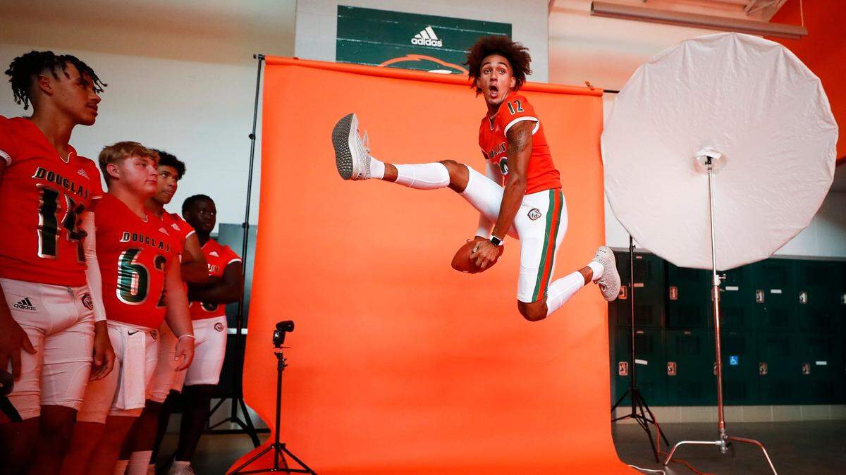 Frederick Douglass wide receiver Dane Key posed for a portrait as teammates looked on at the team’s media day on July 23.