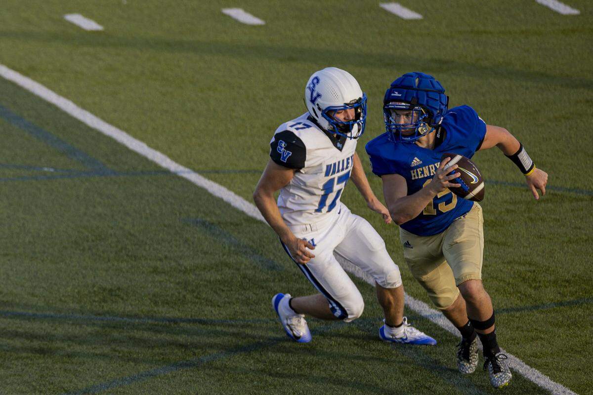 Henry Clay quarterback Aiden Huston runs with the ball during a scrimmage against Shelby Valley on Aug. 8 in Lexington.