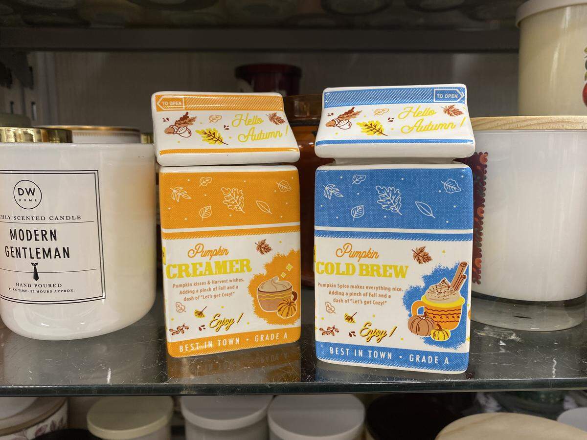 Two candles for sale in a Nicholasville, Ky., Marshalls in the Brannon Crossing shopping center Sept. 8, 2025, are shaped and scented like seasonal coffee creamers for autumn.