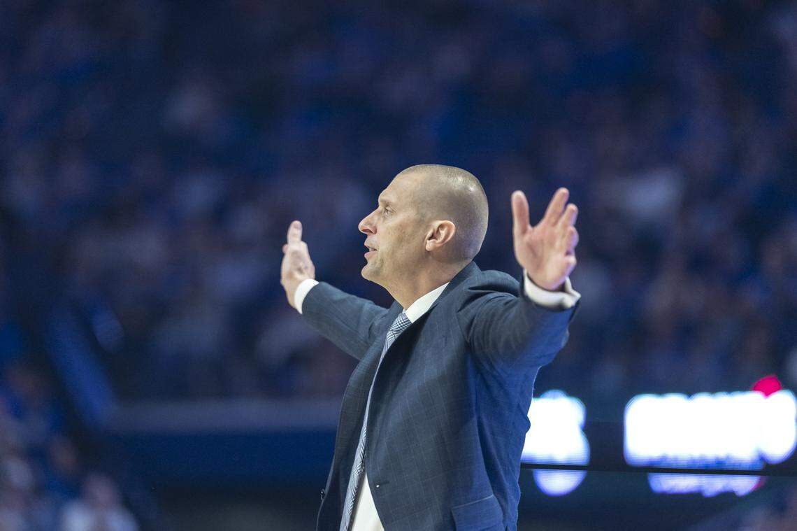 Kentucky head coach Mark Pope talks to his players during Monday’s game at Rupp Arena.