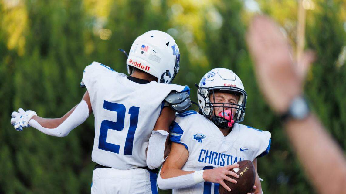 Lexington Christian’s Saxton Howard, right, celebrates with Jeremiah Burbage after Howard scored a touchdown in a game earlier this season.