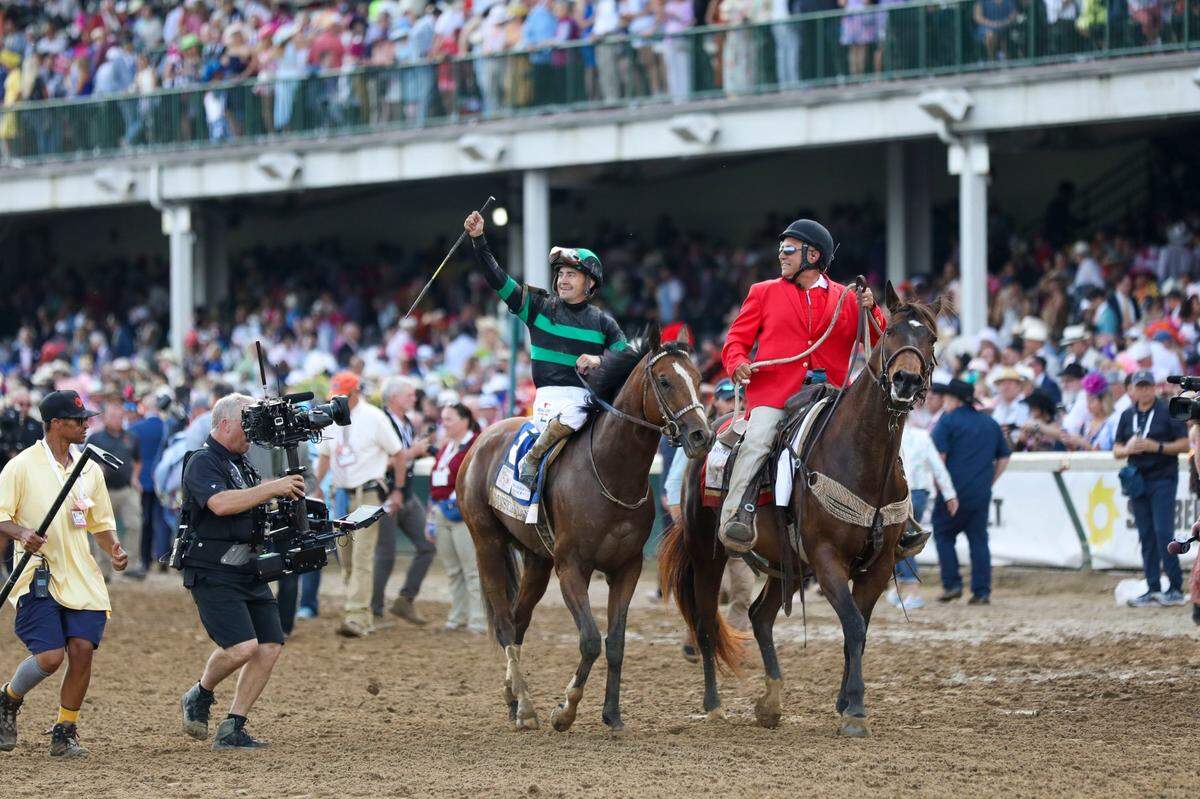 Brian Hernandez Jr. celebrates aboard Mystik Dan after their win in the Kentucky Derby at Churchill Downs on May 4, 2024.
