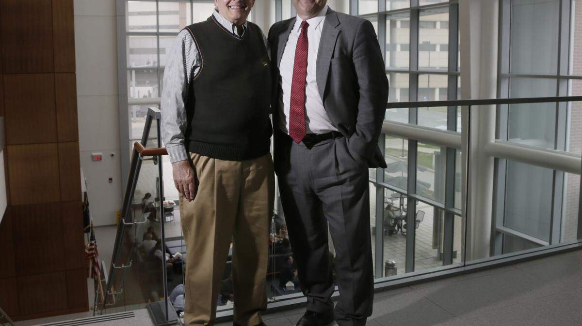 Sheldon Steiner, a microbiology professor at UK, left, found Dr. Geoffrey Manley working as a mechanic. Manley is now the chief of neurosurgery at San Francisco General Hospital.