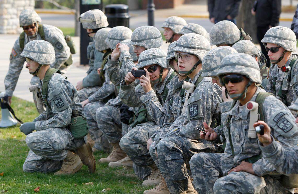 UK ROTC cadets watched and took photos as 2 Army Helicopters landed on the lawn in front of the University of Kentucky Administration Building on The UK campus in Lexington, Ky., Friday, April 1, 2011. Two US Army Blackhawk helicopters landed and 20 chosen ROTC cadets loaded for a ride to Artemus, KY to the Disney Training Facility for a joint Spring Field Training Exercise with U of L. The 20 Cadets were chosen based off an Order of Merit list. Charles Bertram | Staff