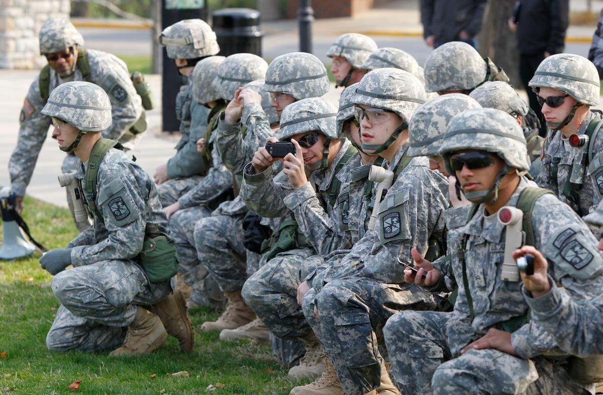 UK ROTC cadets watched and took photos as 2 Army Helicopters landed on the lawn in front of the University of Kentucky Administration Building on The UK campus in Lexington, Ky., Friday, April 1, 2011. Two US Army Blackhawk helicopters landed and 20 chosen ROTC cadets loaded for a ride to Artemus, KY to the Disney Training Facility for a joint Spring Field Training Exercise with U of L. The 20 Cadets were chosen based off an Order of Merit list. Charles Bertram | Staff