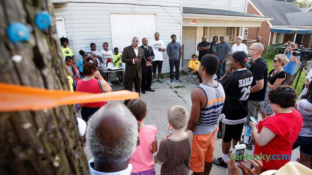 Damon Muhammad spoke at a gathering Sunday at Race and Fifth streets to remember Tony Sullivan, who was killed by Lexington Police Sgt. Phil Vogel in 1994.