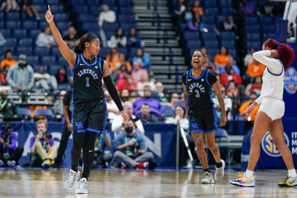 Kentucky’s Robyn Benton (1) and Jazmine Massengill (3) celebrate after Kentucky beat LSU on Friday night to advance to Saturday’s SEC Tournament semifinals.