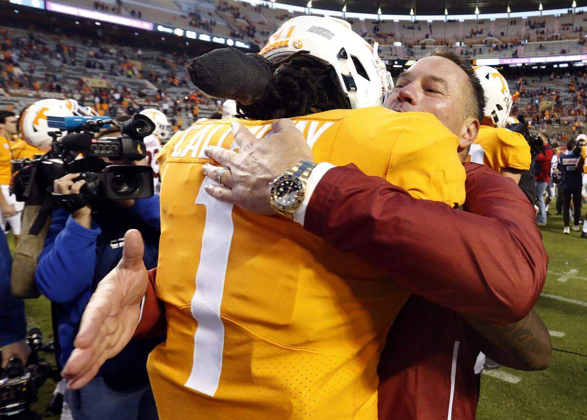 Tennessee standout wide receiver Marquez Callaway (1) hugged ex-UT head coach Butch Jones, now an analyst on Nick Saban’s staff at Alabama, after the Crimson Tide whacked the Volunteers 58-21 earlier this season.