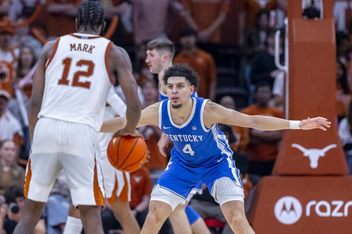 Kentucky guard Koby Brea (4) defends as Texas guard Tramon Mark (12) looks to move the ball during Saturday’s game at the Moody Center in Austin.