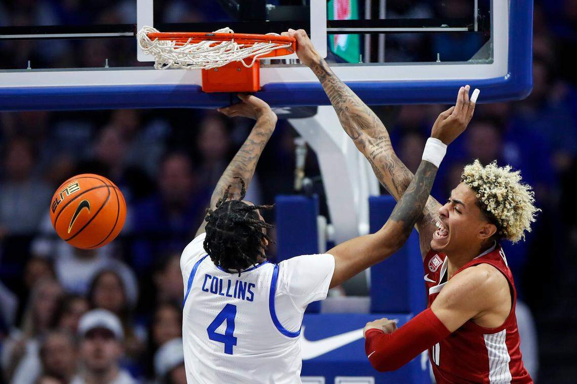 Arkansas’ Jalen Graham (11) dunks over Kentucky’s Daimion Collins (4) in the Razorbacks’ 88-73 win at Rupp Arena on Feb. 7.