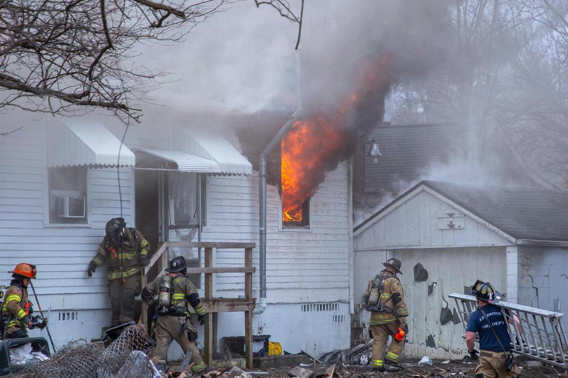 Members of the Lexington Fire Department battle a structure fire on East Seventh Street in Lexington, Ky., on Wednesday, Feb. 8, 2023.