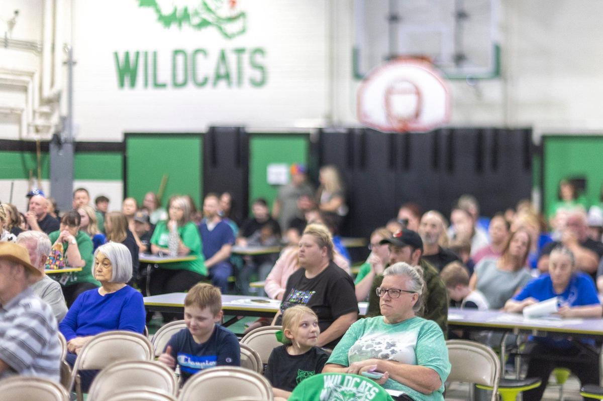 Tammy Day, bottom right, sitting next to her granddaughter, Lillian Day, 11, a fifth-grade student at Arlie Boggs Elementary School, listens during an open meeting at the school in Eolia, Ky., on Thursday, April 17, 2025. The school has faced declining enrollment.