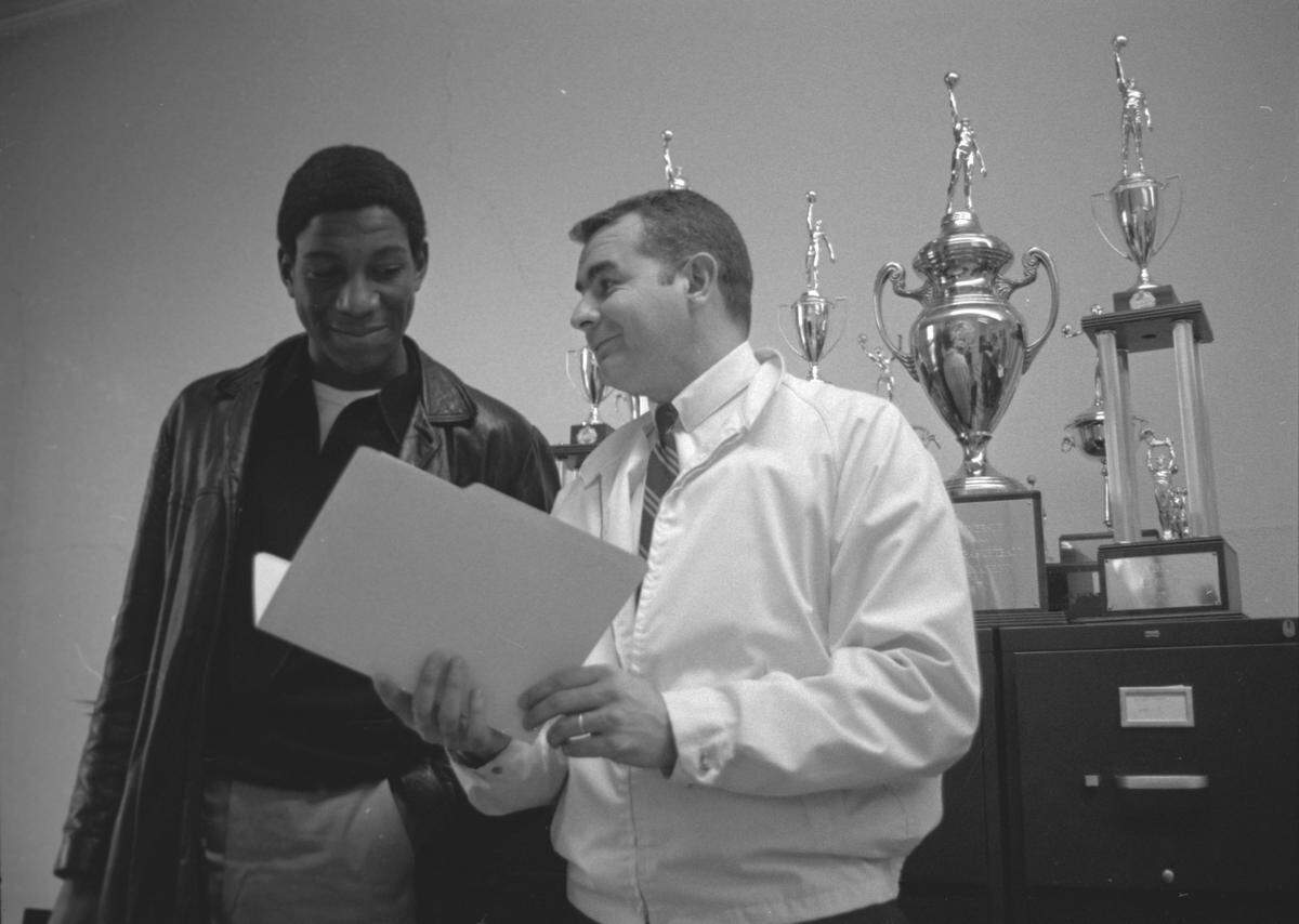 Richmond Madison High School basketball coach Ray Vencill Jr., right, talked with Robert Brooks about his college plans in 1970. Vencill went on to coach at Elizabethtown High School.