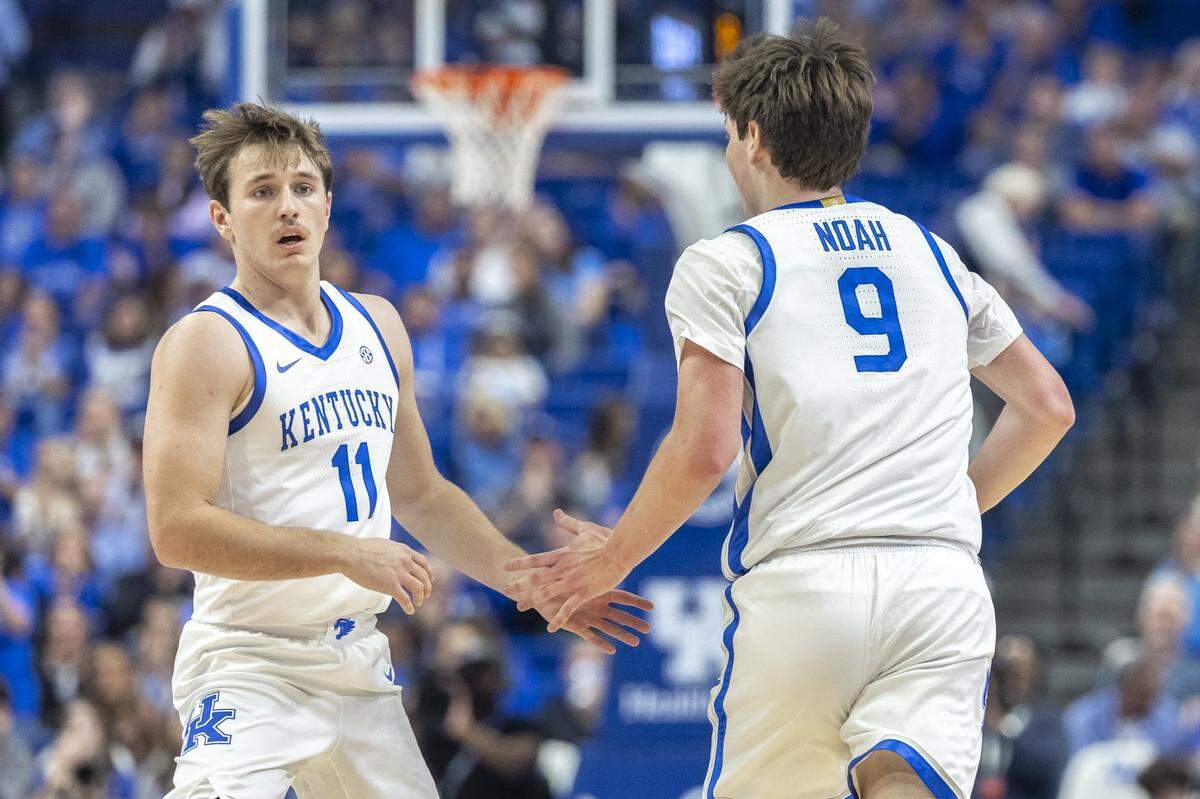 One year after facing each other in the boys’ Sweet 16 state championship game, Kentucky guard Travis Perry (11) and forward Trent Noah (9) are part of UK’s first NCAA Sweet 16 team since 2019.