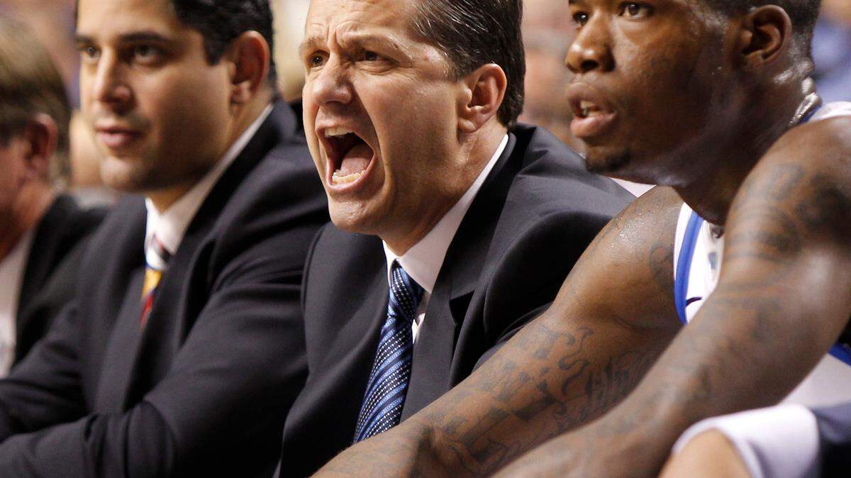 Kentucky Coach John Calipari, center, said he's getting just "50-60 percent" of his players' potential.        