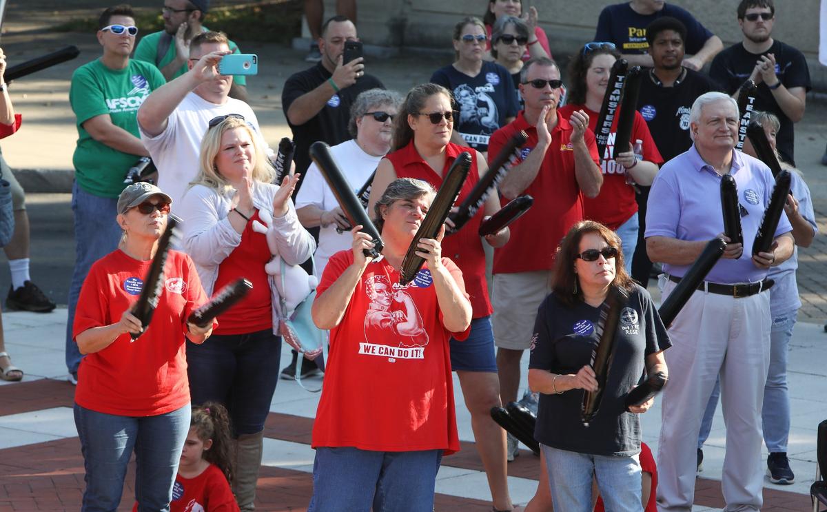 Supporters cheered as state workers and teachers rallied against the pension bill Saturday in Frankfort. Photo by Matt Goins