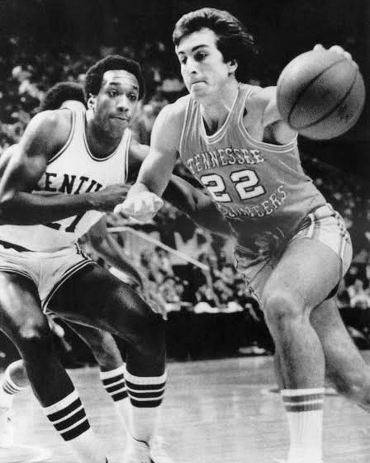Former Tennessee star Ernie Grunfeld (22), shown driving against Kentucky’s Jack Givens, was the focus of one of the great controversies in the history of the UK-UT sports rivalry in 1976.