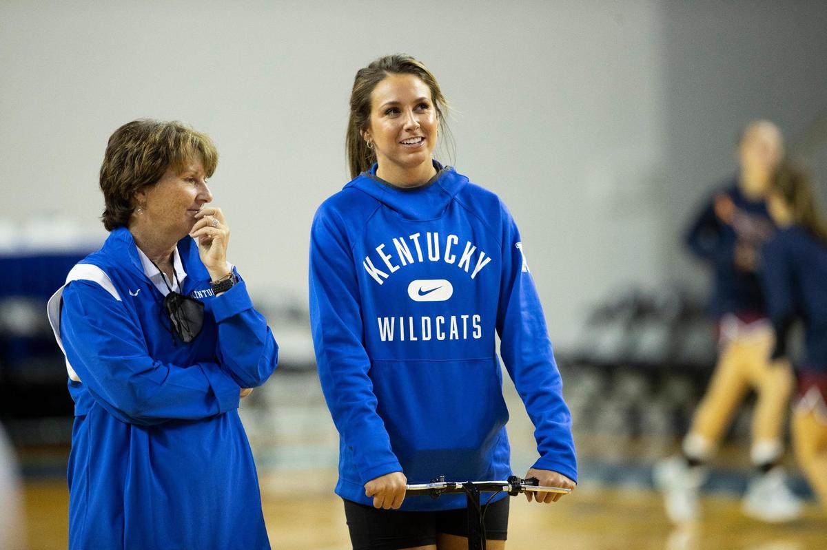 Kentucky’s Blair Green, right, moved around the court on a scooter before the Wildcats’ exhibition game in Memorial Coliseum on Thursday night. The senior guard ruptured her Achilles last Saturday, underwent surgery on Tuesday and is out for the season.