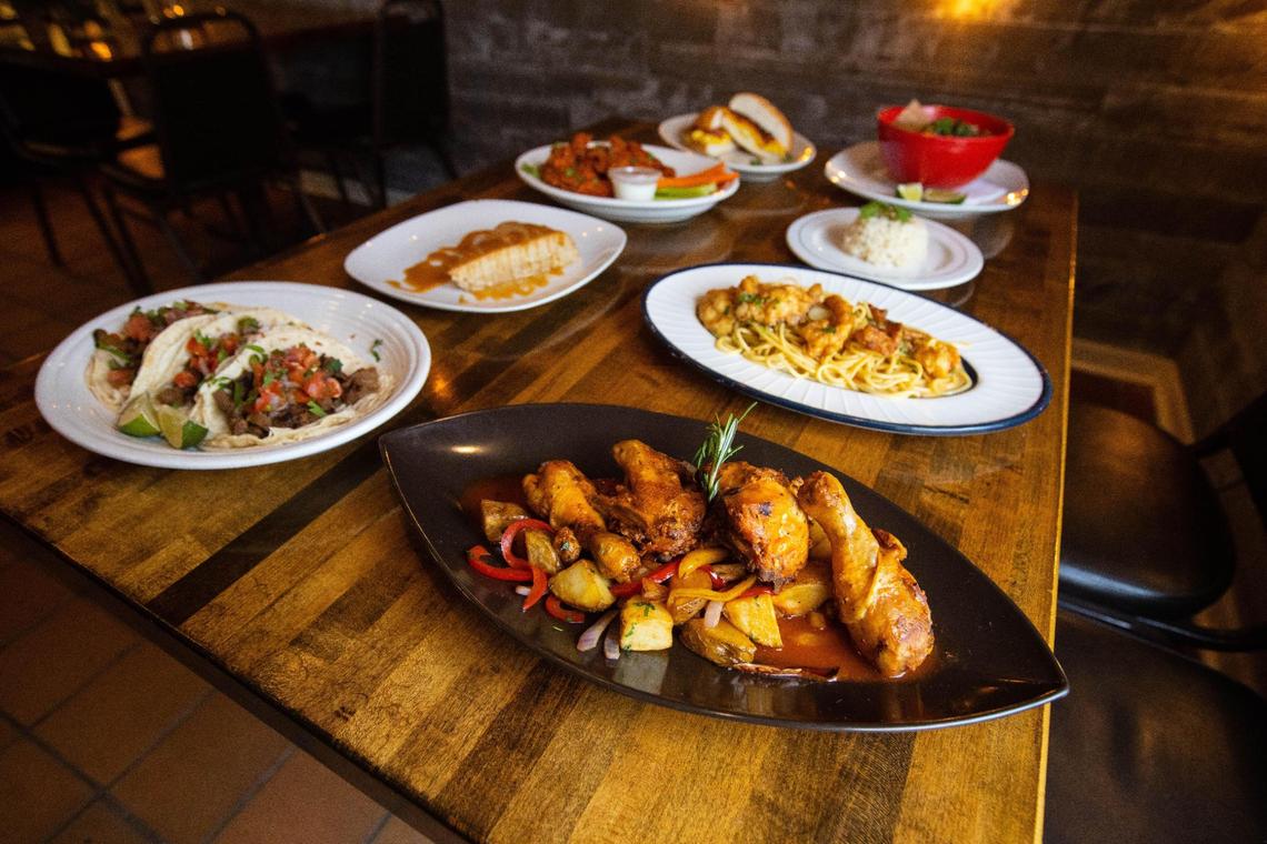 An assortment of menu items, including chicken wings, offered at Liam restaurant within Silver Streak Market on Versailles Road. December 16, 2020.