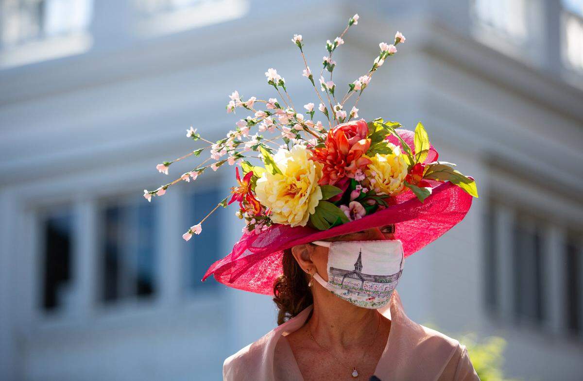 Maria Waters of Clovis, N.M., walks around the paddock at the 147th Kentucky Derby at Churchill Downs in Louisville, Ky., on Saturday, May 1, 2021.