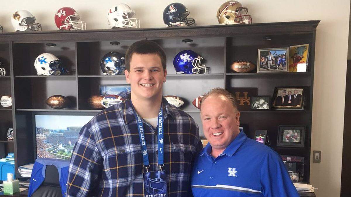 John Young, left, committed to the University of Kentucky on Sunday night. Young is considered a four-star offensive tackle by 247Sports.