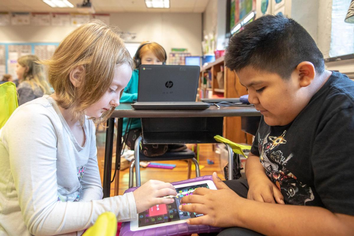 Jasmine Wood, left, and Alex Martinez work at Garth Elementary School in Frankfort, Ky., Monday, Sept. 30, 2019.