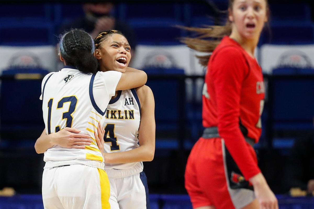 Franklin County’s Brooklynn Miles (13) and Leshauvion Kennedy (4) reacted to the Flyers’ overtime victory.