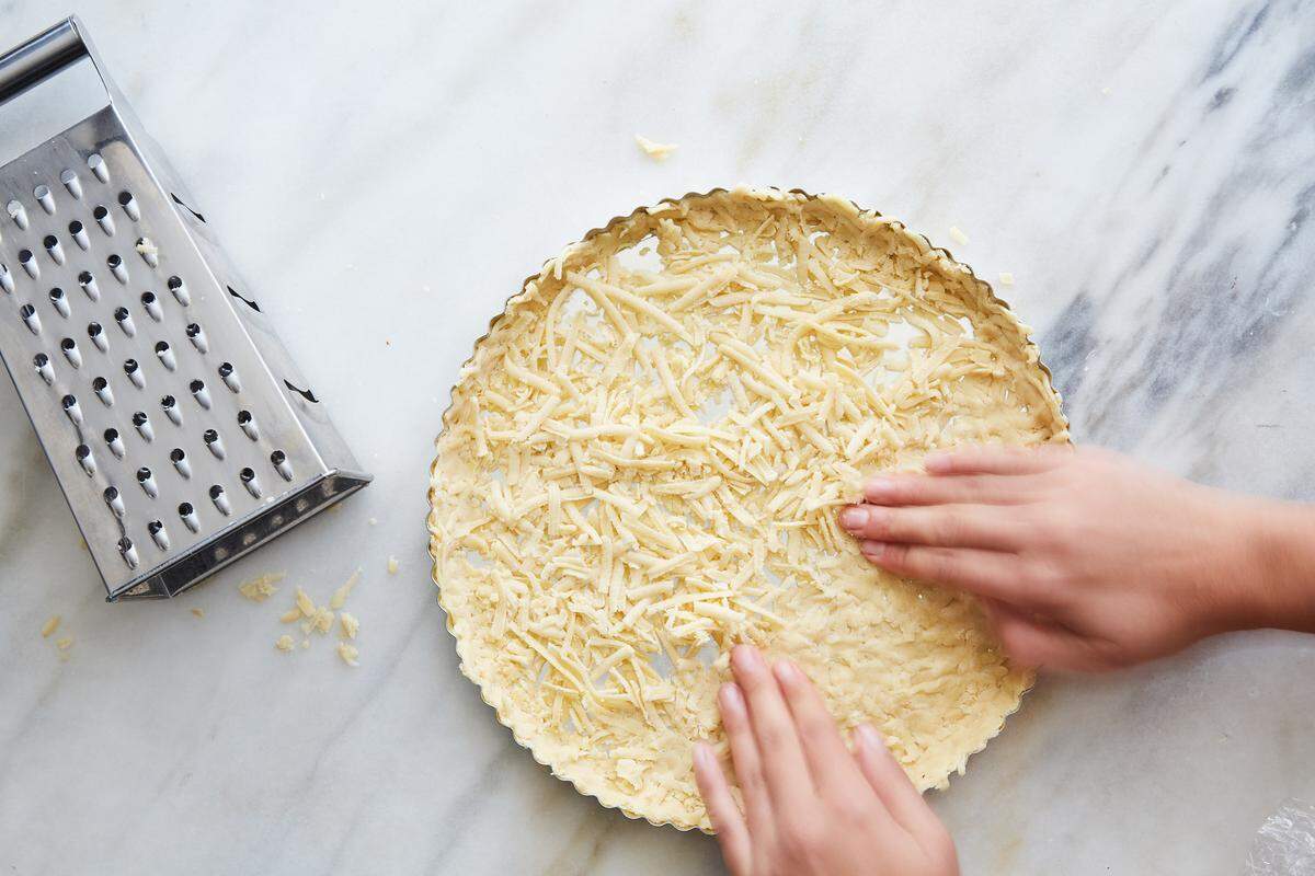 Chilled dough is grated and then pressed directly into a baking dish to create a pie crust. Once the chef Clare de Boer learned the grating trick, she never went back to rolling.