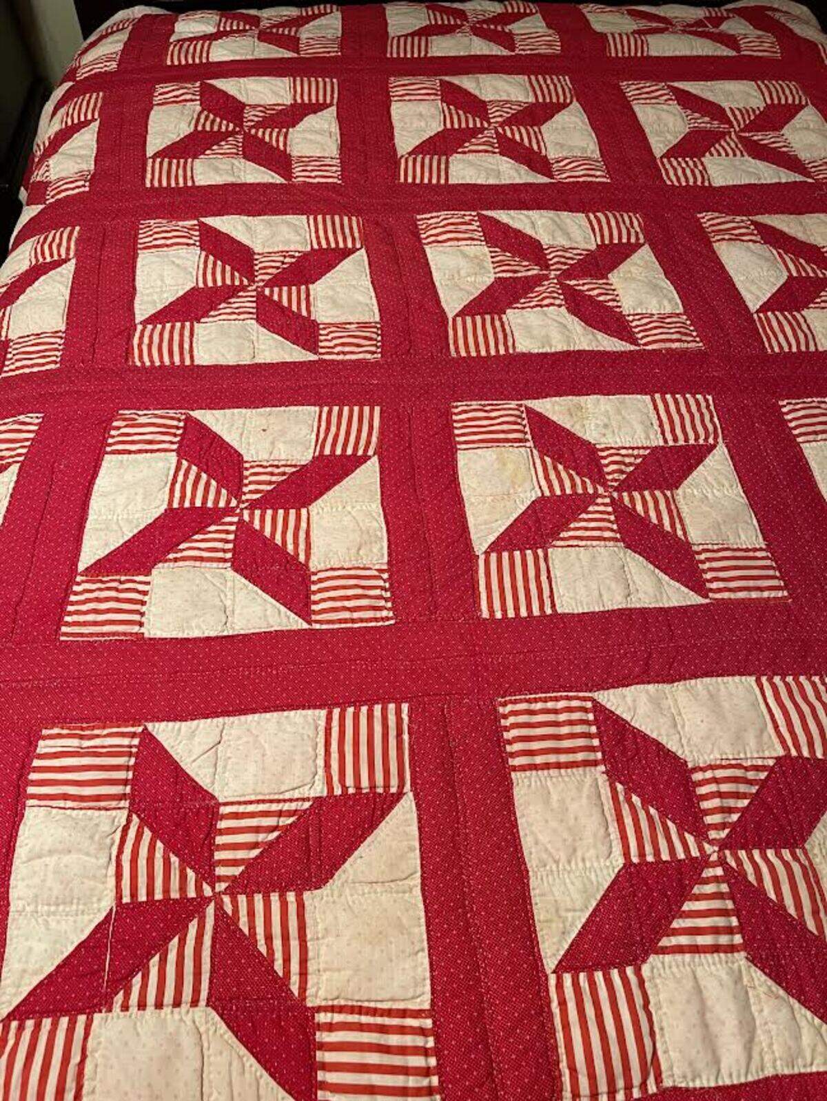 Quilts made by Gilla Miller who died in the July floods in Breathitt County, Kentucky were recovered from muddy water. Volunteers restored them.