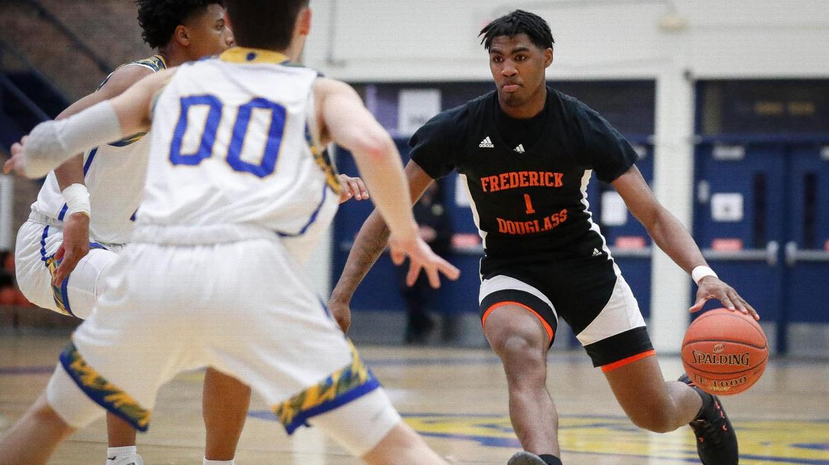 Frederick Douglass’ Dashawn Jackson (1) dribbles down court past Henry Clay’s Aziel Blackwell (2) and Konlin Brown (00) during their game at Henry Clayon March 9. Jackson has been named to the Kentucky All Star roster for its annual series against Indiana.