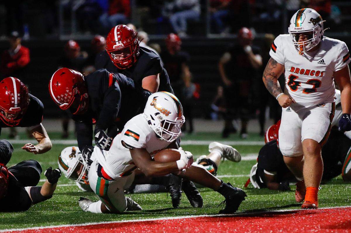 Frederick Douglass’s Davaun Hart (26) scores a touchdown against Scott County at Birds Nest Stadium at Great Crossing High School on Sept. 23.