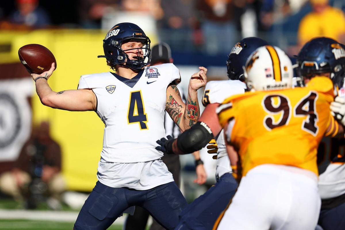 During his junior regular season in 2024, Toledo quarterback Tucker Gleason (4) threw for 2,457 yards and 22 touchdowns vs. seven interceptions and ran for 330 yards and six TDs.